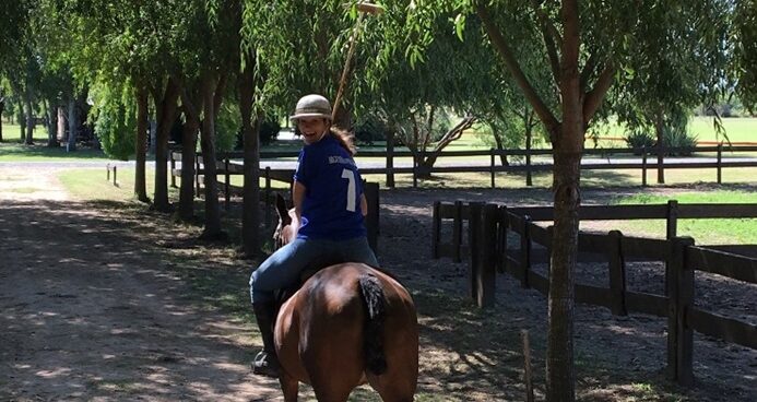 polo player riding horse